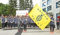 President CHAN is passing the flag to the Sports Team Representatives.
